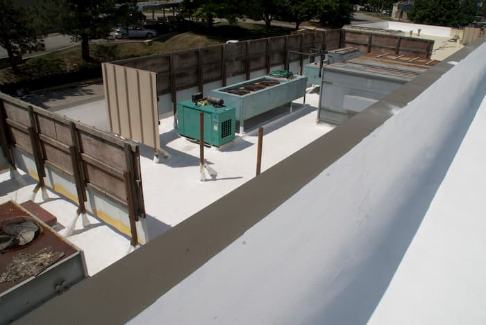 5 Undeniable Benefits of Waterproofing Your Metal Roof - Hawkeye Flat Roof Solutions